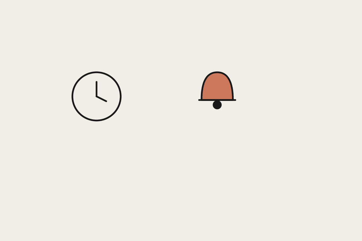 A clock beside a terracotta bell