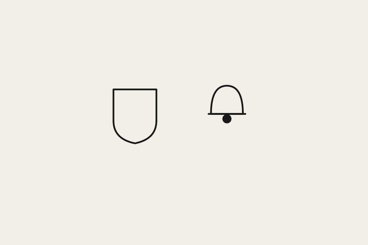 A shield and a bell representing hard spend limits and alerts on AI usage