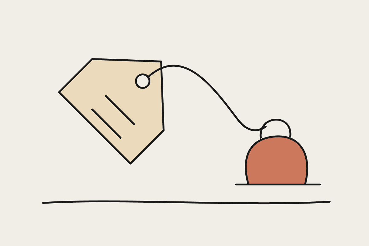 Hand-drawn price tag tied by a string to a heavy terracotta weight