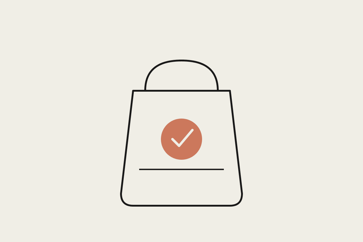 Line illustration of a shopping bag with a terracotta checkmark circle in the centre