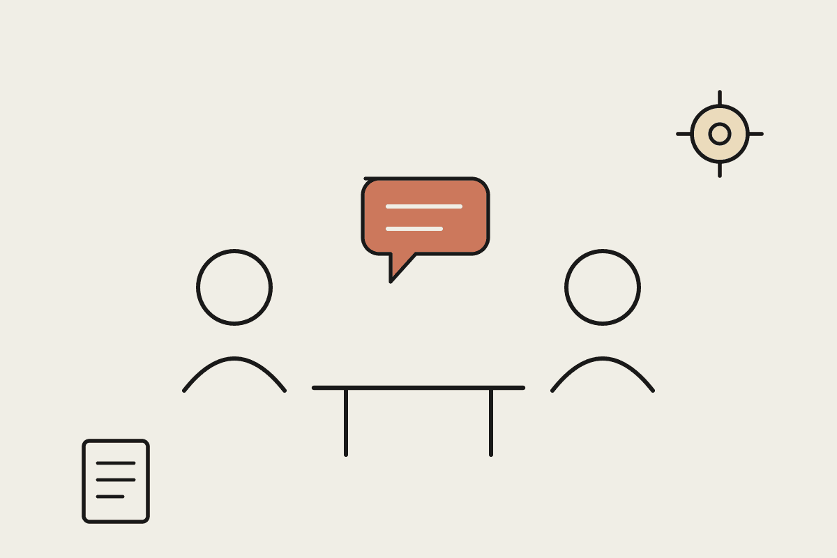 Two people in consultation across a table with a terracotta speech bubble, a gear and a document nearby